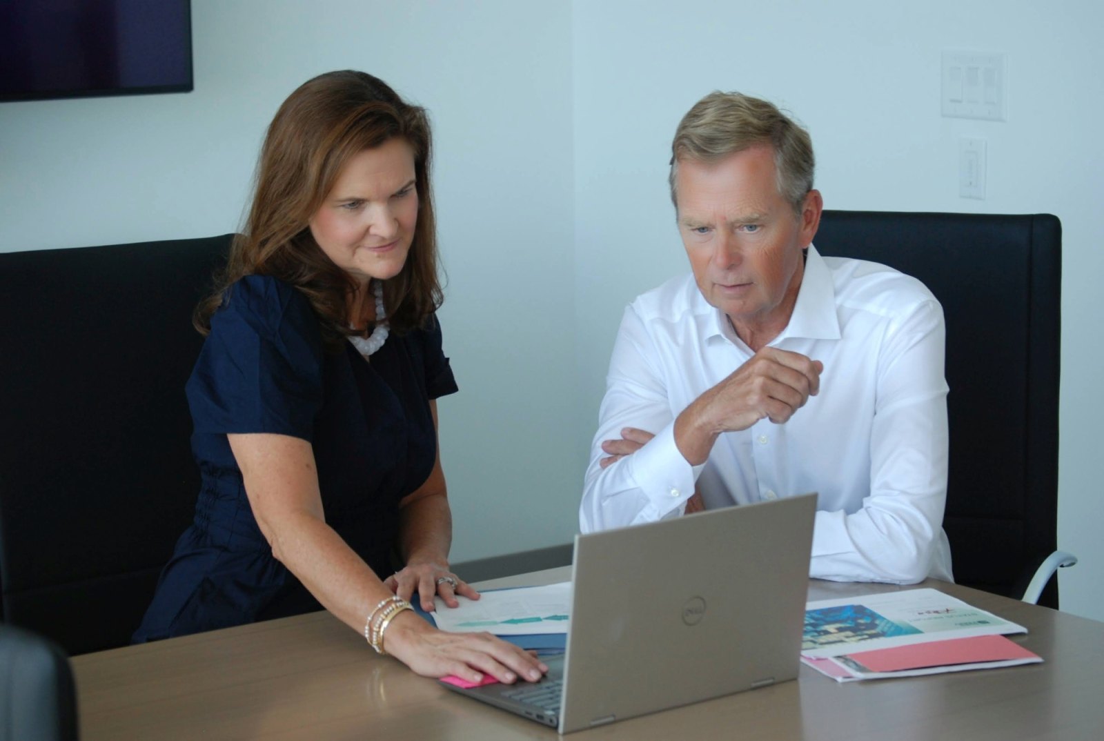 Kristi and Cal reviewing client materials together